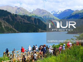 Tourists are visiting the Tianchi Scenic spot in Fukang, China, on July 8, 2024. (