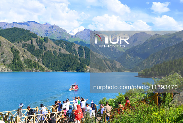 Tourists are visiting the Tianchi Scenic spot in Fukang, China, on July 8, 2024. 