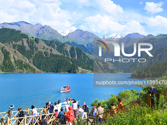 Tourists are visiting the Tianchi Scenic spot in Fukang, China, on July 8, 2024. (