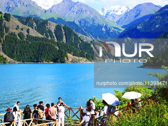 Tourists are visiting the Tianchi Scenic spot in Fukang, China, on July 8, 2024. (