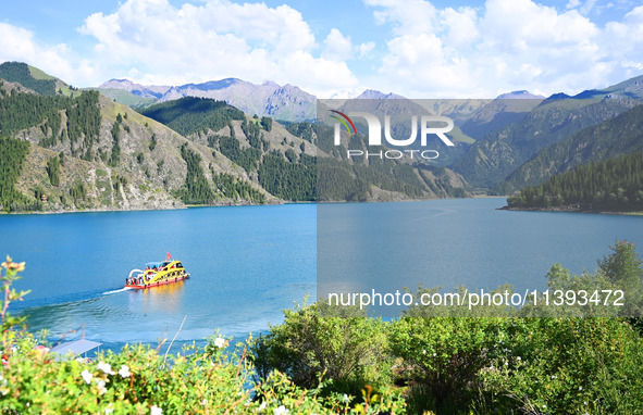 Tourists are visiting the Tianchi Scenic spot in Fukang, China, on July 8, 2024. 