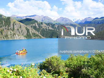 Tourists are visiting the Tianchi Scenic spot in Fukang, China, on July 8, 2024. (