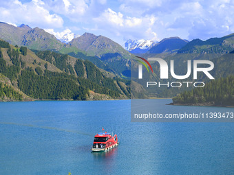 Tourists are visiting the Tianchi Scenic spot in Fukang, China, on July 8, 2024. (