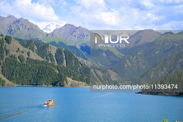 Tourists are visiting the Tianchi Scenic spot in Fukang, China, on July 8, 2024. 