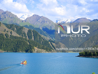 Tourists are visiting the Tianchi Scenic spot in Fukang, China, on July 8, 2024. (