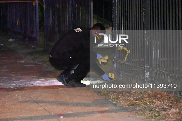 Evidence markers are being placed at the crime scene. A mass shooting is injuring four people in Washington, D.C., United States, on July 8,...