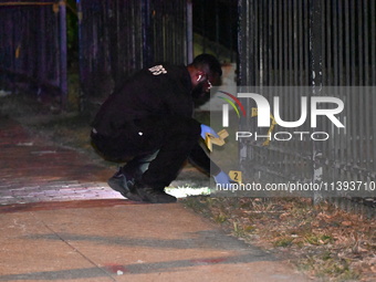 Evidence markers are being placed at the crime scene. A mass shooting is injuring four people in Washington, D.C., United States, on July 8,...