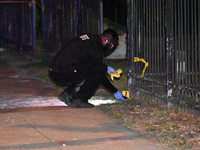 Evidence markers are being placed at the crime scene. A mass shooting is injuring four people in Washington, D.C., United States, on July 8,...