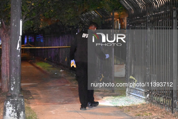 Evidence markers are being placed at the crime scene. A mass shooting is injuring four people in Washington, D.C., United States, on July 8,...