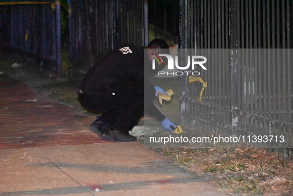 Evidence markers are being placed at the crime scene. A mass shooting is injuring four people in Washington, D.C., United States, on July 8,...