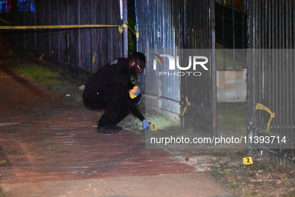 Evidence markers are being placed at the crime scene. A mass shooting is injuring four people in Washington, D.C., United States, on July 8,...