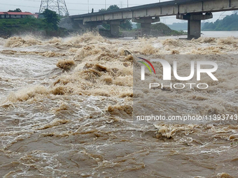 Water levels are rising in the Mahananda River and the Teesta Canal Fulbari near Siliguri, India, on July 9, 2024, due to heavy rainfall in...