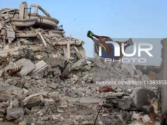 Palestinian youths are playing parkour at the ruins of a building destroyed in recent Israeli air strikes, in Zawayda, in the central Gaza S...