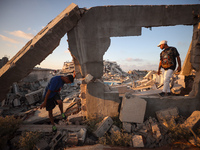 Palestinian youths are playing parkour at the ruins of a building destroyed in recent Israeli air strikes, in Zawayda, in the central Gaza S...