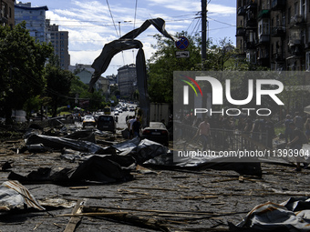 People are walking in a street covered with debris after a Russian missile strike in Kyiv, Ukraine, on July 08, 2024, amid the Russian invas...