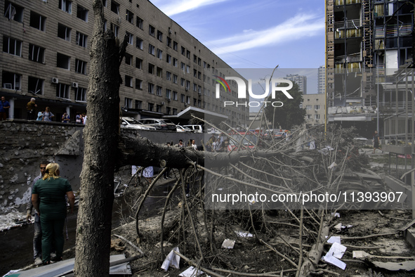 Rescuers and volunteers are working at Ohmatdyt Children's Hospital that was strongly damaged during a Russian missile strike in Kyiv, Ukrai...