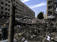 Rescuers and volunteers are working at Ohmatdyt Children's Hospital that was strongly damaged during a Russian missile strike in Kyiv, Ukrai...