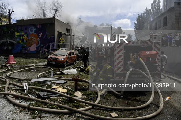 Rescuers and volunteers are working at Ohmatdyt Children's Hospital that was strongly damaged during a Russian missile strike in Kyiv, Ukrai...