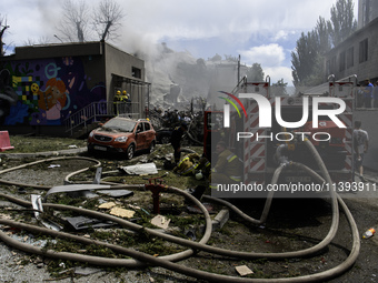 Rescuers and volunteers are working at Ohmatdyt Children's Hospital that was strongly damaged during a Russian missile strike in Kyiv, Ukrai...