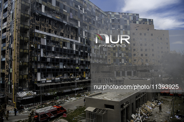 Rescuers and volunteers are working at Ohmatdyt Children's Hospital that was strongly damaged during a Russian missile strike in Kyiv, Ukrai...