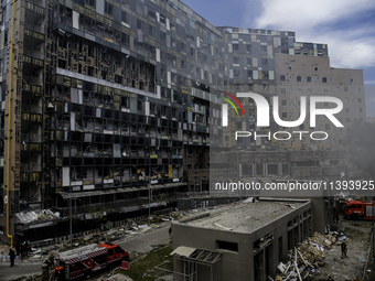 Rescuers and volunteers are working at Ohmatdyt Children's Hospital that was strongly damaged during a Russian missile strike in Kyiv, Ukrai...