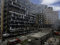 Rescuers and volunteers are working at Ohmatdyt Children's Hospital that was strongly damaged during a Russian missile strike in Kyiv, Ukrai...