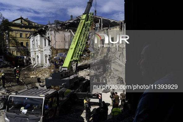 Rescuers and volunteers are working at Ohmatdyt Children's Hospital that was strongly damaged during a Russian missile strike in Kyiv, Ukrai...