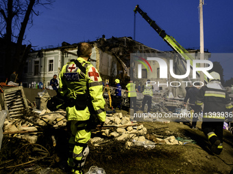 Rescuers are working at Ohmatdyt Children's Hospital that is strongly damaged during a Russian missile strike in Kyiv, Ukraine, on July 08,...