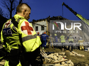 Rescuers are working at Ohmatdyt Children's Hospital that is strongly damaged during a Russian missile strike in Kyiv, Ukraine, on July 08,...