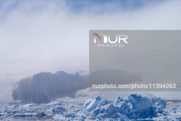 The Ilulissat Icefjord, also known as Sermeq Kujalleq, is draining approximately 7% of Greenland's ice sheet in Ilulissat, Greenland, on Jun...