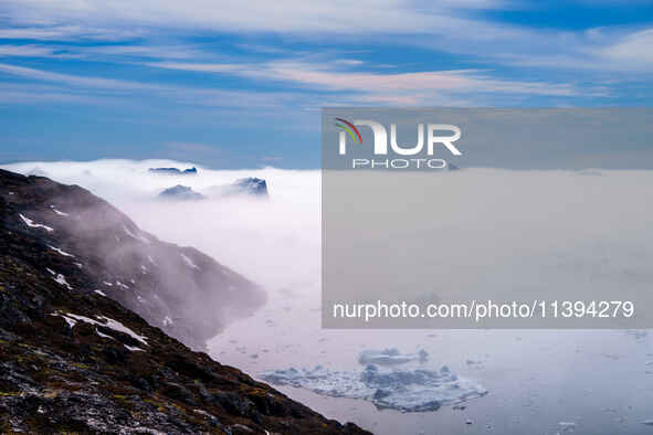 The Ilulissat Icefjord, also known as Sermeq Kujalleq, is draining approximately 7% of Greenland's ice sheet in Ilulissat, Greenland, on Jun...