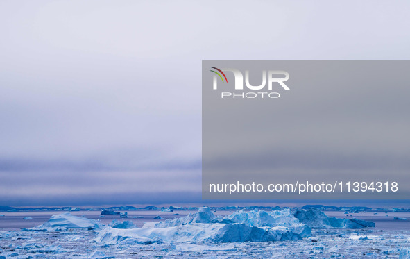 The Ilulissat Icefjord, also known as Sermeq Kujalleq, is draining approximately 7% of Greenland's ice sheet in Ilulissat, Greenland, on Jun...