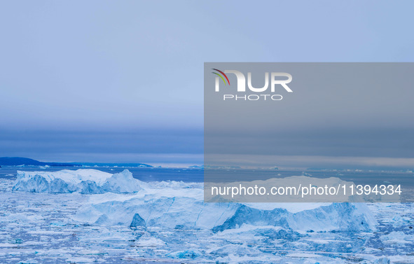 The Ilulissat Icefjord, also known as Sermeq Kujalleq, is draining approximately 7% of Greenland's ice sheet. This glacier, the largest outs...