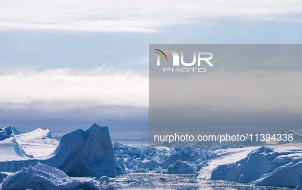 The Ilulissat Icefjord, also known as Sermeq Kujalleq, is draining approximately 7% of Greenland's ice sheet. This glacier, the largest outs...