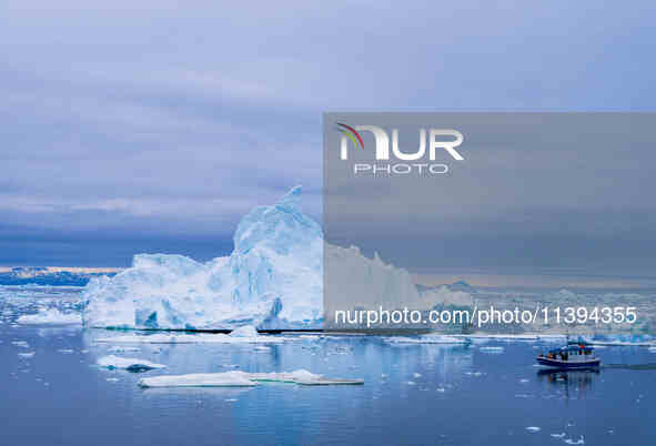 The Ilulissat Icefjord, also known as Sermeq Kujalleq, is draining approximately 7% of Greenland's ice sheet in Ilulissat, Greenland, on Jun...