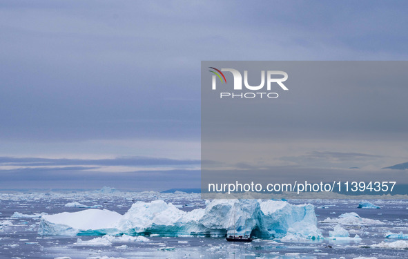 The Ilulissat Icefjord, also known as Sermeq Kujalleq, is draining approximately 7% of Greenland's ice sheet in Ilulissat, Greenland, on Jun...