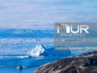 The Ilulissat Icefjord, also known as Sermeq Kujalleq, is draining approximately 7% of Greenland's ice sheet in Ilulissat, Greenland, on Jun...