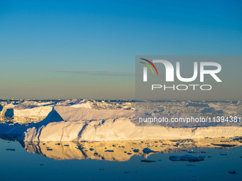 The Ilulissat Icefjord, also known as Sermeq Kujalleq, is draining approximately 7% of Greenland's ice sheet in Ilulissat, Greenland, on Jun...