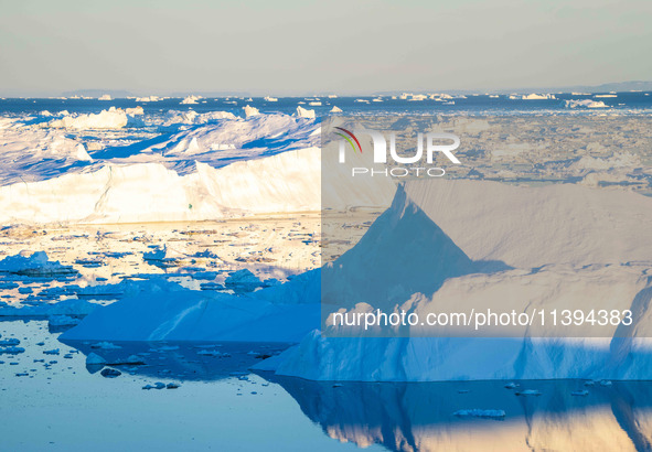 The Ilulissat Icefjord, also known as Sermeq Kujalleq, is draining approximately 7% of Greenland's ice sheet in Ilulissat, Greenland, on Jun...