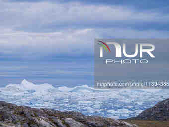 The Ilulissat Icefjord, also known as Sermeq Kujalleq, is draining approximately 7% of Greenland's ice sheet in Ilulissat, Greenland, on Jun...