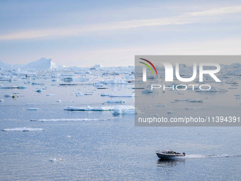 The Ilulissat Icefjord, also known as Sermeq Kujalleq, is draining approximately 7% of Greenland's ice sheet in Ilulissat, Greenland, on Jun...