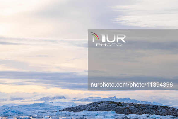 The Ilulissat Icefjord, also known as Sermeq Kujalleq, is draining approximately 7% of Greenland's ice sheet in Ilulissat, Greenland, on Jul...