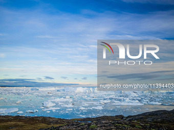 The Ilulissat Icefjord, also known as Sermeq Kujalleq, is draining approximately 7% of Greenland's ice sheet in Ilulissat, Greenland, on Jul...