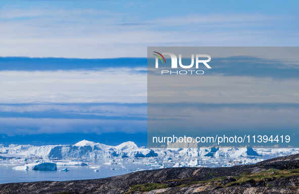 The Ilulissat Icefjord, also known as Sermeq Kujalleq, is draining approximately 7% of Greenland's ice sheet. This glacier, the largest outs...