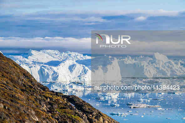 The Ilulissat Icefjord, also known as Sermeq Kujalleq, is draining approximately 7% of Greenland's ice sheet in Ilulissat, Greenland, on Jul...