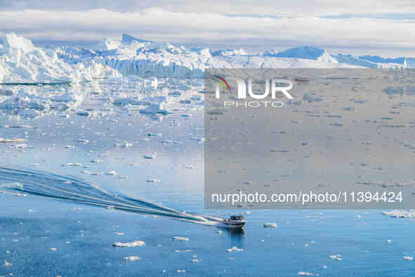 The Ilulissat Icefjord, also known as Sermeq Kujalleq, is draining approximately 7% of Greenland's ice sheet in Ilulissat, Greenland, on Jun...