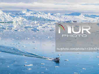 The Ilulissat Icefjord, also known as Sermeq Kujalleq, is draining approximately 7% of Greenland's ice sheet in Ilulissat, Greenland, on Jun...