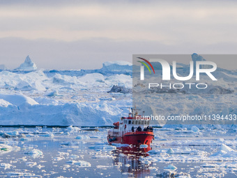 The Ilulissat Icefjord, also known as Sermeq Kujalleq, is draining approximately 7% of Greenland's ice sheet in Ilulissat, Greenland, on Jun...