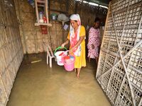 Women are staying inside their flooded house after heavy rainfall in Nagaon district of Assam, India, on July 9, 2024. (