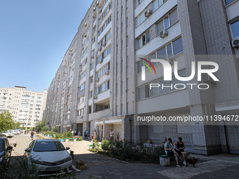 Residents are staying outside an apartment block damaged by the Russian missile attack in Dnipro, Ukraine, on July 8, 2024. NO USE RUSSIA. N...